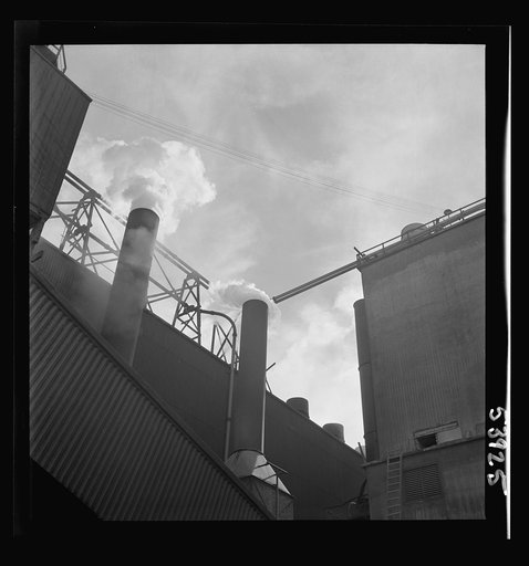 Untitled photo, possibly related to: Las Vegas, Nevada. Smoke pouring from the stacks of the preparation building of the Basic Magnesium Incorporated plant, where magnesium, the lightest of all metals is being produced in great quantities for war use
