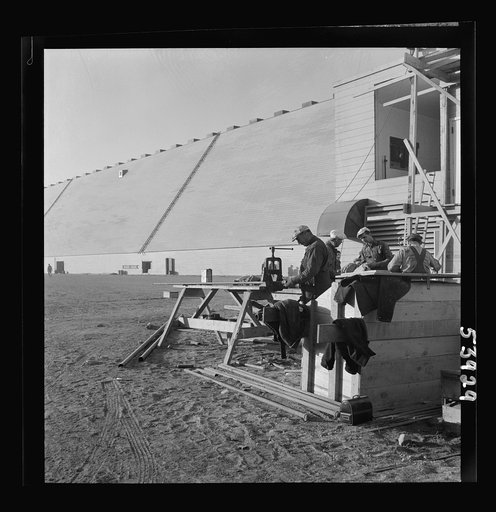 Untitled photo, possibly related to: Las Vegas, Nevada. Giant silos, eighty-four feet high, for the storage of ore for the manufacture of magnesium, and a peat-storage building on the grounds of Basic Magnesium Incorporated