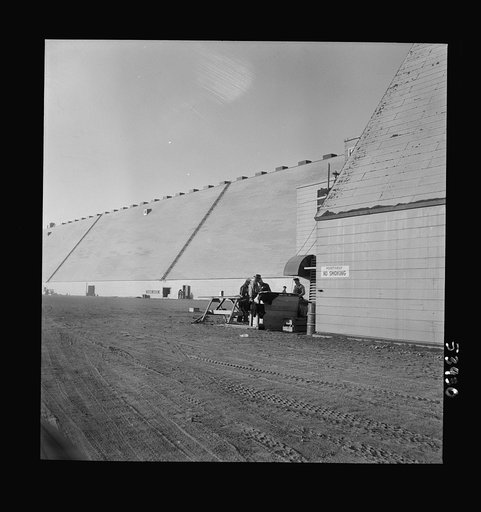 Untitled photo, possibly related to: Las Vegas, Nevada. Giant silos, eighty-four feet high, for the storage of ore for the manufacture of magnesium, and a peat-storage building on the grounds of Basic Magnesium Incorporated