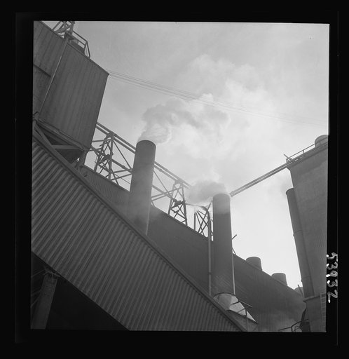 Untitled photo, possibly related to: Las Vegas, Nevada. Smoke pouring from the stacks of the preparation building of the Basic Magnesium Incorporated plant, where magnesium, the lightest of all metals is being produced in great quantities for war use