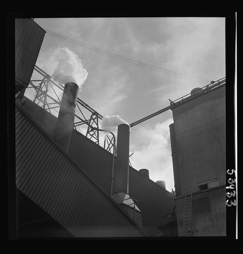 Untitled photo, possibly related to: Las Vegas, Nevada. Smoke pouring from the stacks of the preparation building of the Basic Magnesium Incorporated plant, where magnesium, the lightest of all metals is being produced in great quantities for war use