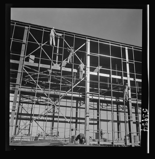 Untitled photo, possibly related to: Las Vegas, Nevada. Painters at work seventy feet above ground on the gigantic construction of the Basic Magnesium Incorporated plant in the southern Nevada desert