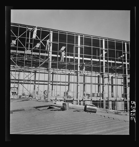 Untitled photo, possibly related to: Las Vegas, Nevada. Painters at work seventy feet above ground on the gigantic construction of the Basic Magnesium Incorporated plant in the southern Nevada desert