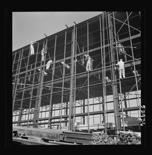 Untitled photo, possibly related to: Las Vegas, Nevada. Painters at work seventy feet above ground on the gigantic construction of the Basic Magnesium Incorporated plant in the southern Nevada desert