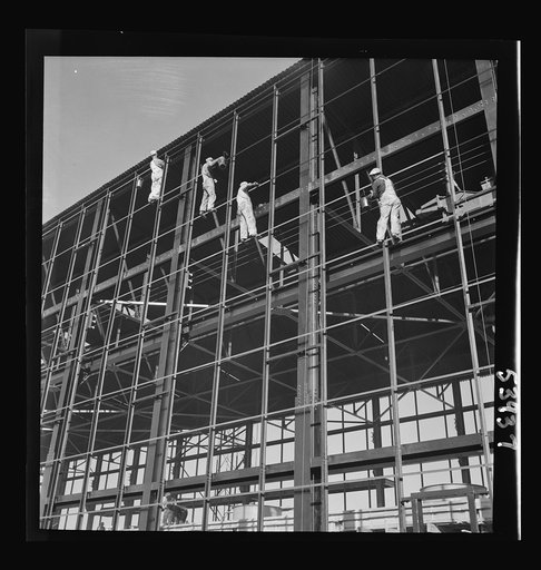 Untitled photo, possibly related to: Las Vegas, Nevada. Painters at work seventy feet above ground on the gigantic construction of the Basic Magnesium Incorporated plant in the southern Nevada desert