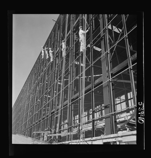 Untitled photo, possibly related to: Las Vegas, Nevada. Painters at work seventy feet above ground on the gigantic construction of the Basic Magnesium Incorporated plant in the southern Nevada desert