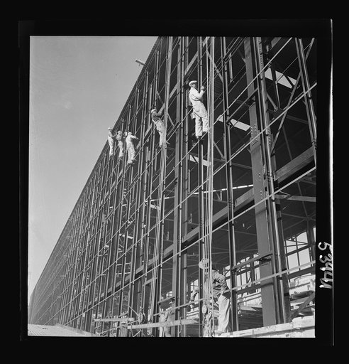 Untitled photo, possibly related to: Las Vegas, Nevada. Painters at work seventy feet above ground on the gigantic construction of the Basic Magnesium Incorporated plant in the southern Nevada desert