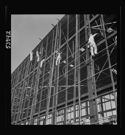 Untitled photo, possibly related to: Las Vegas, Nevada. Painters at work seventy feet above ground on the gigantic construction of the Basic Magnesium Incorporated plant in the southern Nevada desert