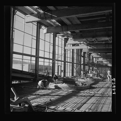 Untitled photo, possibly related to: Las Vegas, Nevada. A construction scene inside one of the huge buildings of the Basic Magnesium Incorporated plant in the southern Nevada desert. Workmen are busy with the steel structure and carpenter work