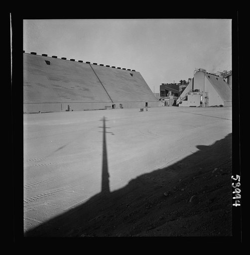 Untitled photo, possibly related to: Las Vegas, Nevada. Peat storage buildings, silos for the storage of ore, and other structures of the Basic Magnesium Incorporated plant in the southern Nevada desert