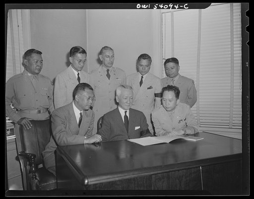 Washington, D.C. The new president of the Philippines shown with the new cabinet. Front row; left to right: Jaime Hernandez, Secretary of Finance; President Sergio Osmena; Colonel Carlos P. Romulo, Resident Commissioner and Secretary of Information. Back row, left to right: Colonel Mariano A. Erana,