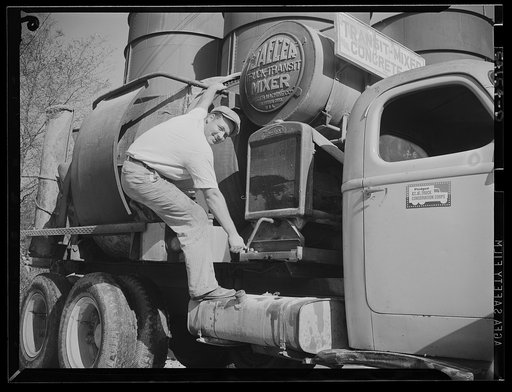 Washington, D.C. A commercial truck with the driver standing at the door of it where there is displayed a United States Truck Conservation Corps pledge