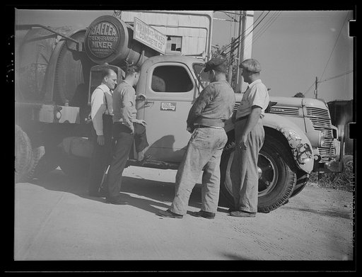 Washington, D.C. A Jaeger truck-transit mixer showing four men looking at the United States Truck Conservation Corps pledge on the door of the truck