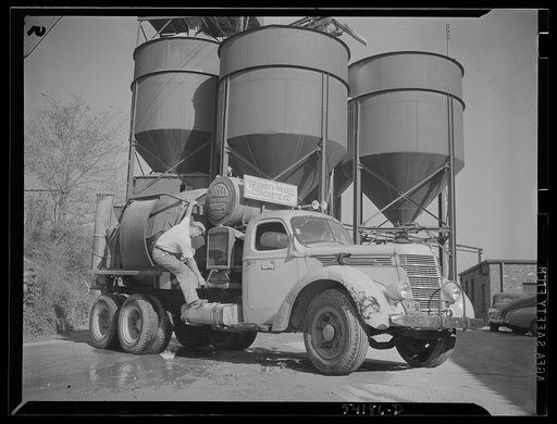 Untitled photo, possibly related to: Washington, D.C. A commercial truck with the driver standing at the door of it where there is displayed a United States Truck Conservation Corps pledge