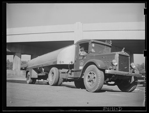 Untitled photo, possibly related to: Washington, D.C. An O. Boyle truck showing two girls, one inside it and one on the running board, looking at the United States Truck Conservation Corps pledge on the door of it