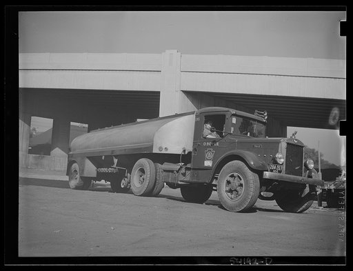 Untitled photo, possibly related to: Washington, D.C. An O. Boyle truck showing two girls, one inside it and one on the running board, looking at the United States Truck Conservation Corps pledge on the door of it