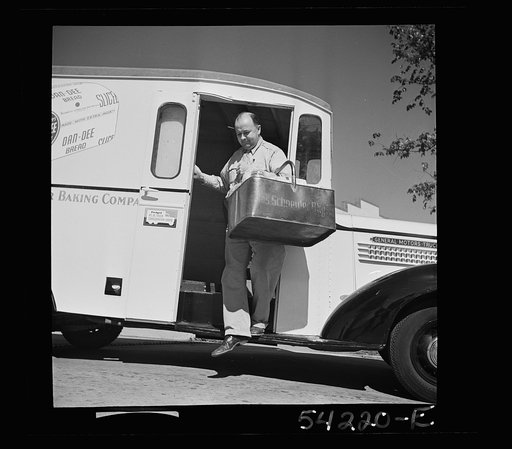 Washington, D.C. A Charles Schneider Baking Company delivery truck displaying a United States Truck Conservaton Corps pledge, showing a driver alighting with a basket of bread