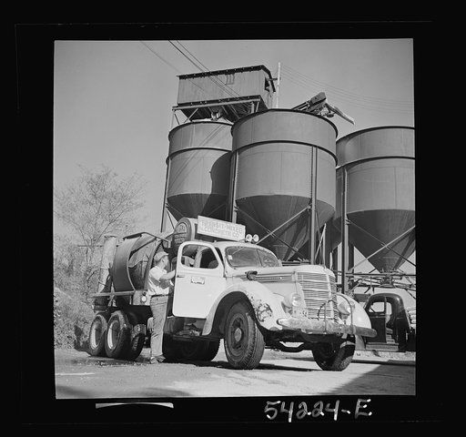 Untitled photo, possibly related to: Washington, D.C. A Jaeger truck-transit mixer, showing a man operating the mixer. On the door of the truck is the United States Truck Conservation Corps pledge