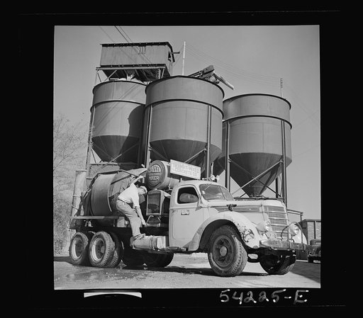 Untitled photo, possibly related to: Washington, D.C. A Jaeger truck-transit mixer, showing a man operating the mixer. On the door of the truck is the United States Truck Conservation Corps pledge