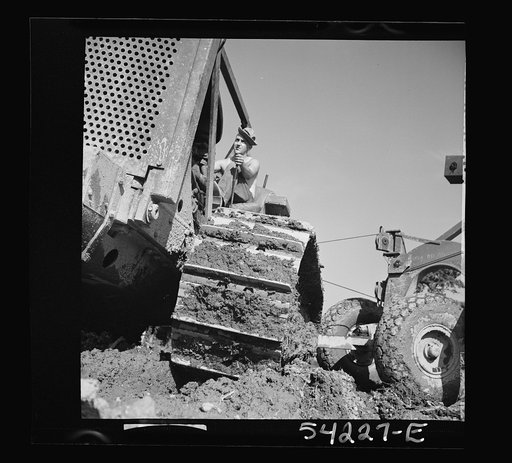 Untitled photo, possibly related to: Fort Blvoir, Virginia. A soldier operating a heavy duty tractor