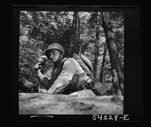 Untitled photo, possibly related to: Fort Belvoir, Virginia. A soldier throwing a hand grenade