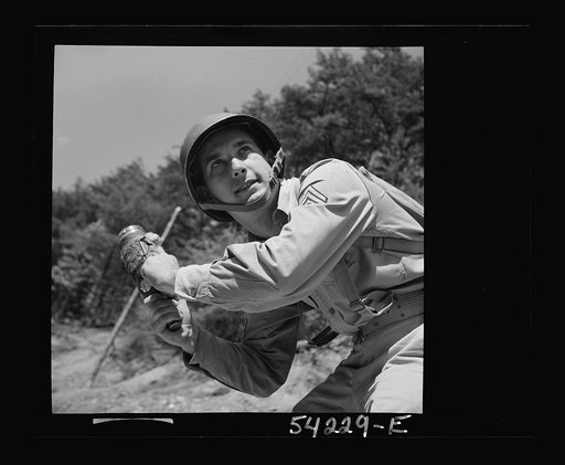 Fort Belvoir, Virginia. A soldier learning to throw a hand grenade