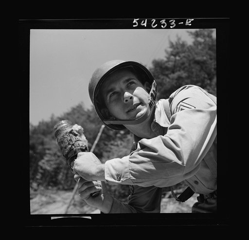 Untitled photo, possibly related to: Fort Belvoir, Virginia. A soldier learning to throw a hand grenade