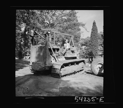 Fort Belvoir, Virginia. A soldier operating a heavy duty tractor