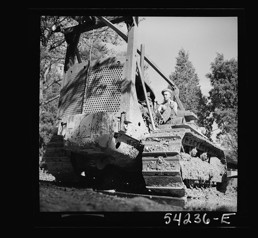 Untitled photo, possibly related to: Fort Belvoir, Virginia. A soldier operating a heavy duty tractor