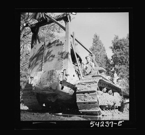 Untitled photo, possibly related to: Fort Belvoir, Virginia. A soldier operating a heavy duty tractor