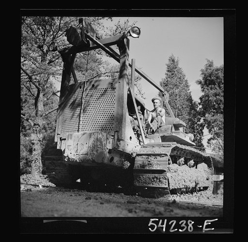 Fort Belvoir, Virginia. A soldier operating a heavy duty tractor