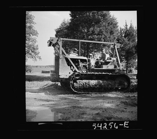 Untitled photo, possibly related to: Fort Blvoir, Virginia. A soldier operating a heavy duty tractor