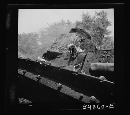 Untitled photo, possibly related to: Fort Belvoir, Virginia. A burning armored tank, showing the effects of a hit by a "Molotov cocktail" grenade