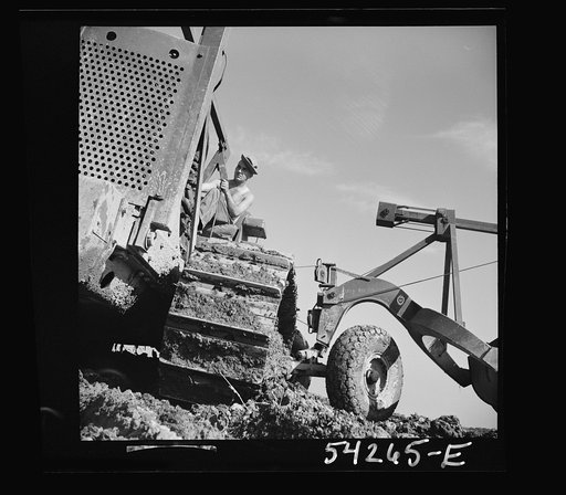 Untitled photo, possibly related to: Fort Blvoir, Virginia. A soldier operating a heavy duty tractor