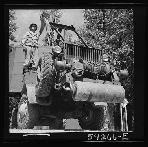 Fort Belvoir, Virginia. A soldier on a truck with a mounted crane