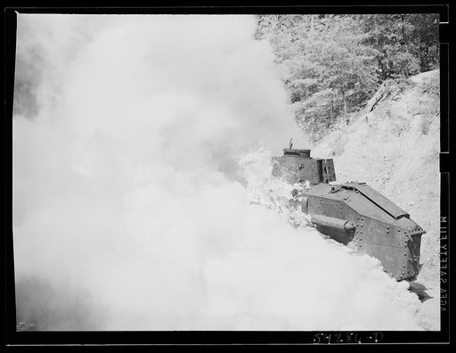 Untitled photo, possibly related to: Fort Belvoir, Virginia. A burning armored tank, showing the effects of a hit by a "Molotov cocktail" grenade