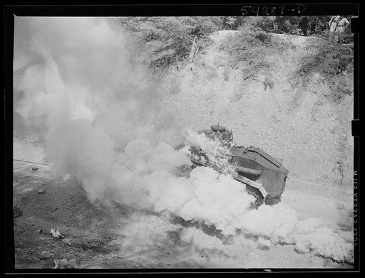 Fort Belvoir, Virginia. A burning armored tank, showing the effects of a hit by a "Molotov cocktail" grenade