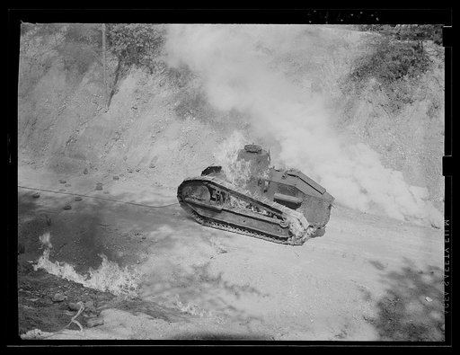Fort Belvoir, Virginia. A burning armored tank, showing the effects of a hit by a "Molotov cocktail" grenade