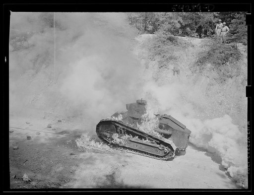 Untitled photo, possibly related to: Fort Belvoir, Virginia. A burning armored tank, showing the effects of a hit by a "Molotov cocktail" grenade