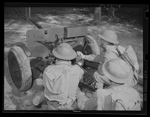 Fort Belvoir, Virginia. Three United States Engineers learning to operate a field piece
