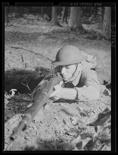 Untitled photo, possibly related to: Fort Belvoir, Virginia. A soldier on the ground practicing with a rifle