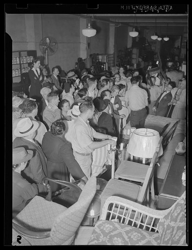 Untitled photo, possibly related to: Washington, D.C. A crowd of people examining furniture to be sold at the Adam A. Weschler & Son auction sale