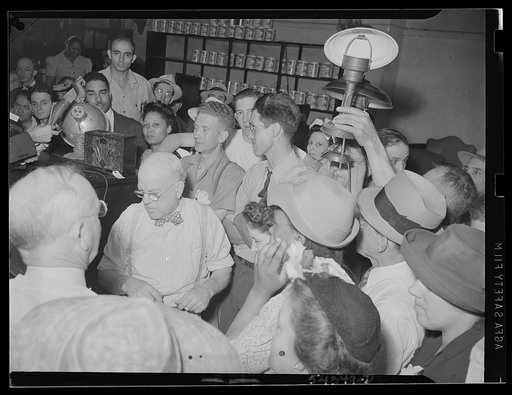Washington, D.C. A crowd at an auction sale in the store owned by Adam A. Weschler & Son