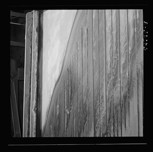Kingman (vicinity), Arizona. Tungsten ore concentrating on tables in a recovery plant near the Boriana mine. There are many vital uses for this ore in the war effort
