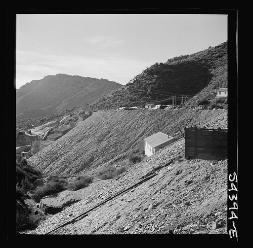 Untitled photo, possibly related to: Kingman (vicinity), Arizona. A general view showing a huge waste pile and beyond it the recovery plant where tungsten ore is processed. The ore is mined in the nearby Boriana workings