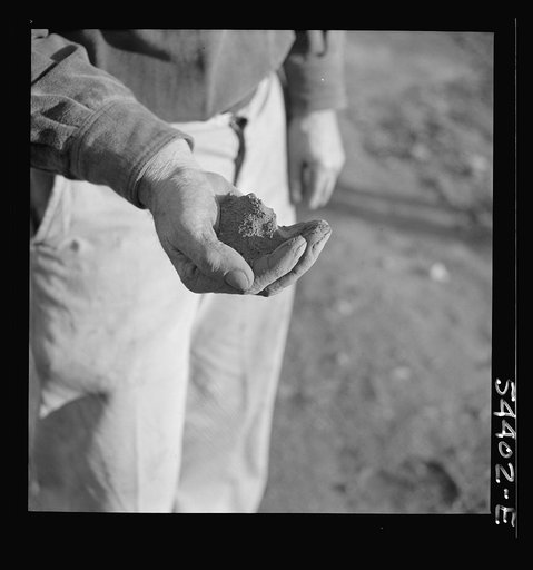 Untitled photo, possibly related to: Kingman (vicinity), Arizona. Powdered tungsten ore, mined near Kingman at the Boriana workings. This ore is used to increase the hardness of steel for cutting tools and, since the war, has been used for many vital war purposes