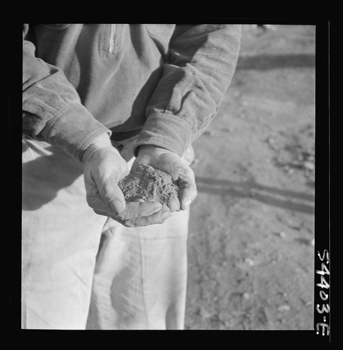 Untitled photo, possibly related to: Kingman (vicinity), Arizona. Powdered tungsten ore, mined near Kingman at the Boriana workings. This ore is used to increase the hardness of steel for cutting tools and, since the war, has been used for many vital war purposes