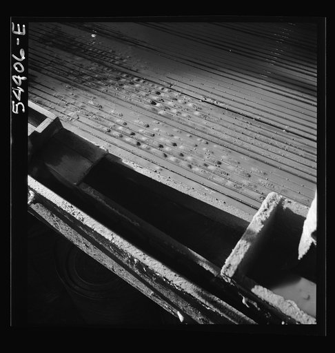 Untitled photo, possibly related to: Kingman (vicinity), Arizona. Concentrating tungsten ore on tables in a recovery plant near the Boriana mine