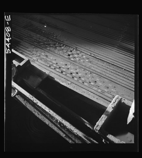 Untitled photo, possibly related to: Kingman (vicinity), Arizona. Concentrating tungsten ore on tables in a recovery plant near the Boriana mine