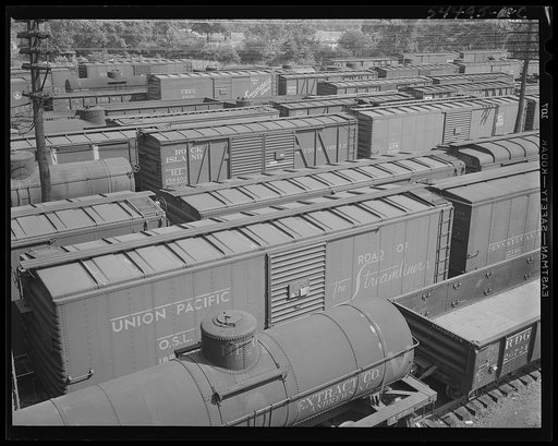 Untitled photo, possibly related to: Chattanooga, Tennessee. Freight cars and oil tanks in the railroad yards
